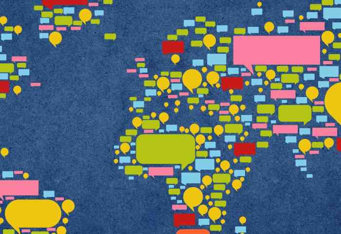 A map of the world made up of colorful speech bubbles.