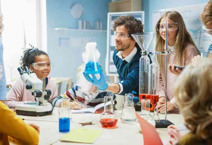 Enthusiastic Teacher Explains Chemistry to Diverse Group of Children