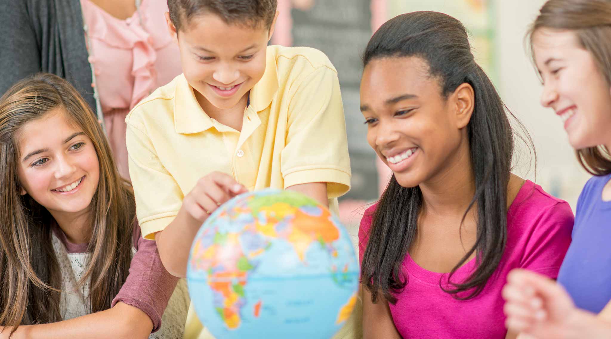 a group of young multi-ethnic children laughing together