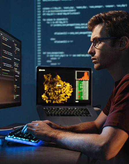Man coding on a computer.