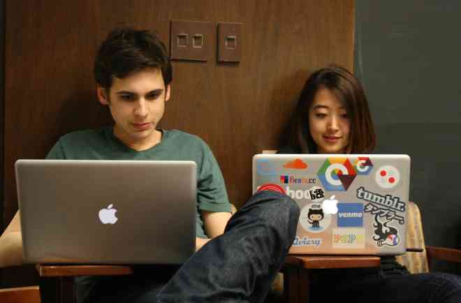 Two students on laptops