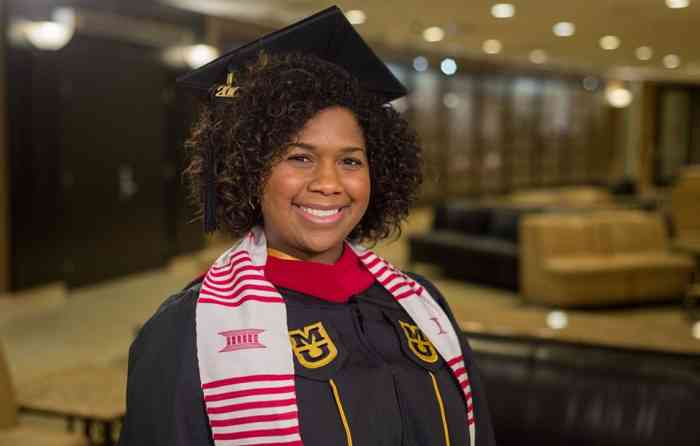 Cassandra Adams Jones, journalism MA, in her graduation cap and gown.