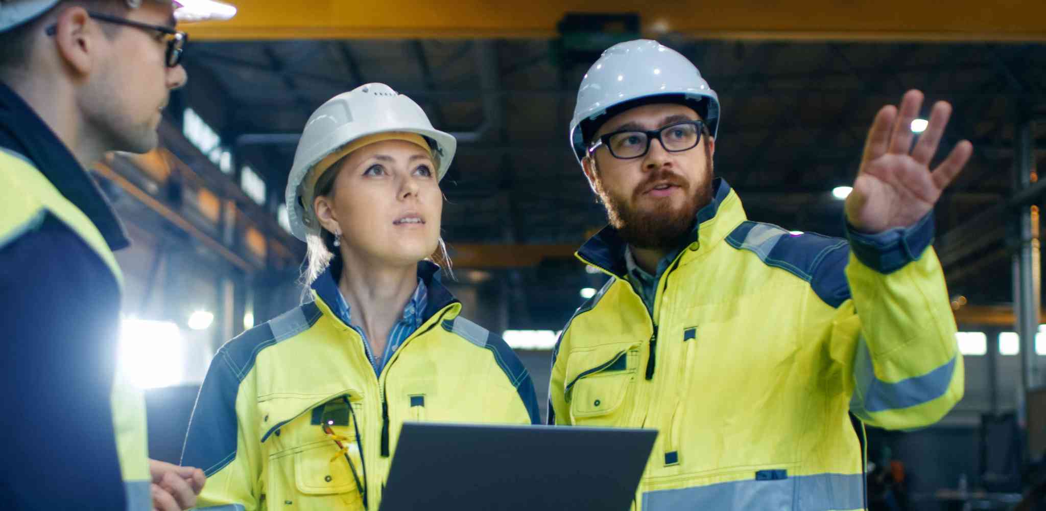A group of engineers wearing hard hats.