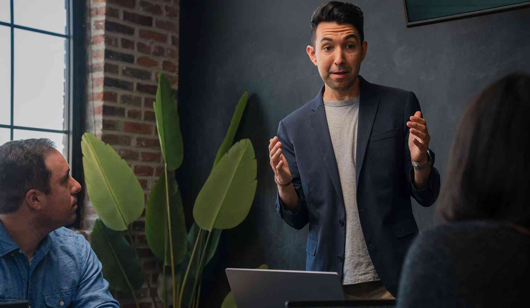 An energetic man leading a meeting.