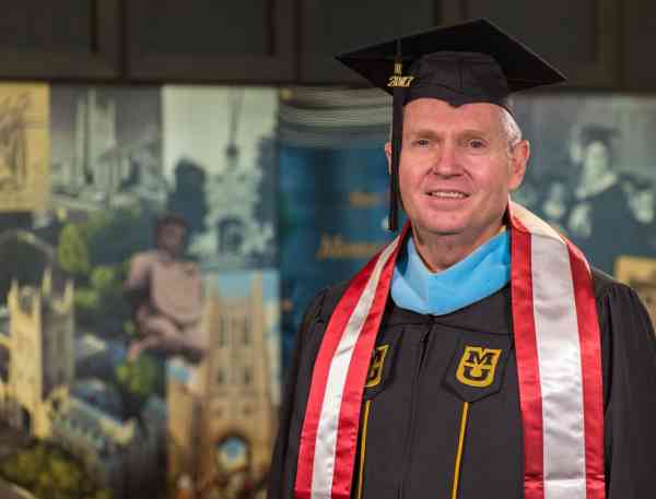 Kevin Poeter, M Ed in positive coaching.