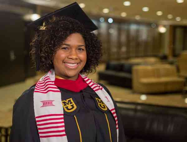 Cassandra Adams Jones, journalism MA, in her graduation cap and gown.
