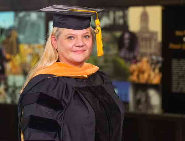 Anita Bowie, DNP, wearing her graduation cap and gown.