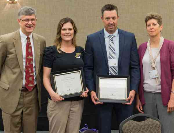 Mizzou educators receive awards for online course design, Wednesday, May 17, 2017, in Columbia, Missouri, from Vice Provost for Undergraduate Studies Jim Spain and Mizzou Online Director Kim Siegenthaler. From left: Spain; Carmen Beck, ET@MO instructional designer; Steve Ball, Nutrition and Exercise Physiology associate professor; and Siegenthaler.