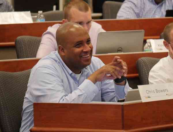 Chris Bowers smiles during an on-campus session.