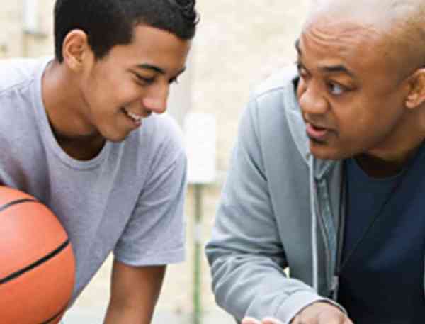 A basketball coach and students.