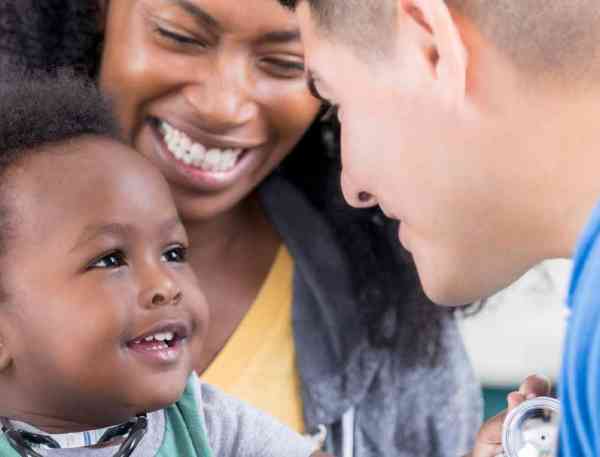 Family nurse practitioner with parent and child.