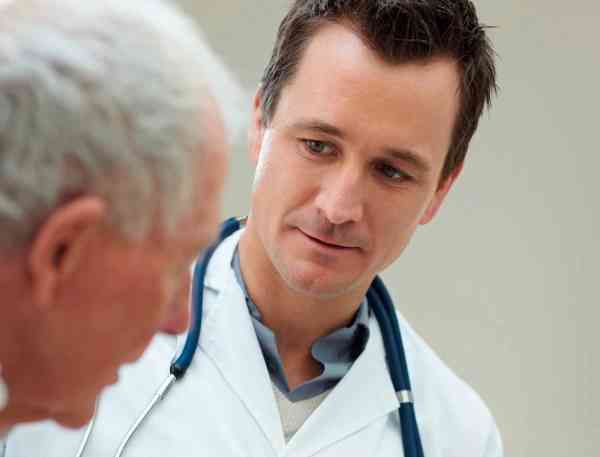 Medical professional talking to a patient.