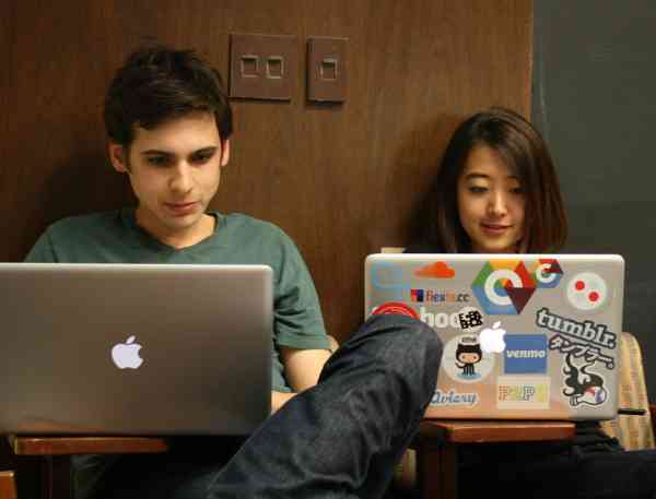 Two students on laptops