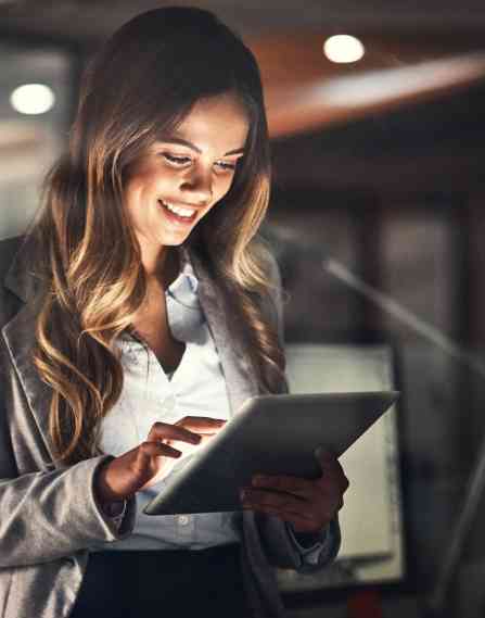 Business professional looking down at tablet.