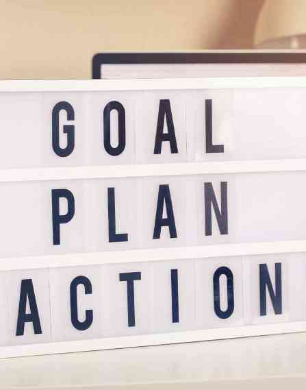 A sign that reads "goal, plan, action."