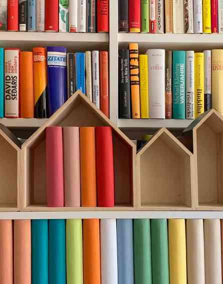 Bookshelf with books going in various directions.