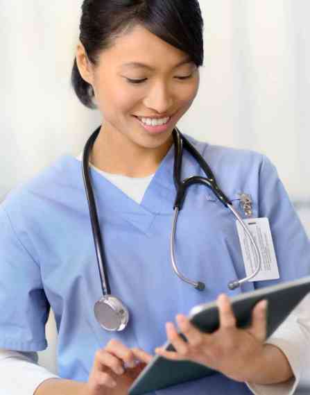 Medical professional looking at a chart.