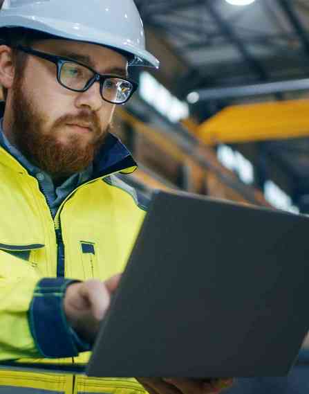 Industrial engineer on laptop.