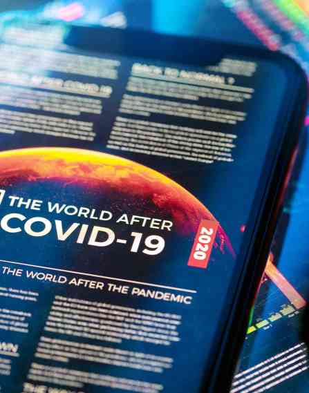 A cellphone that reads "the world after COVID-19."