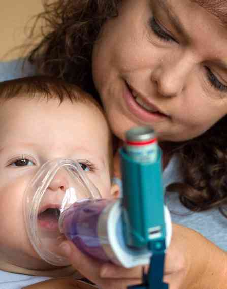 A respiratory therapist with a child.