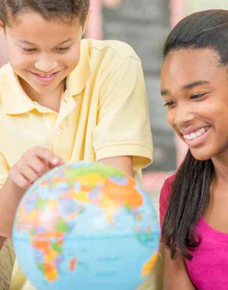a group of young multi-ethnic children laughing together