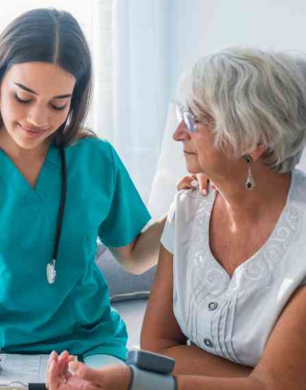 Nurse talking to an elder patient.