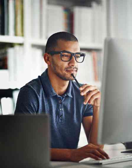 businessman using his computer in his home office