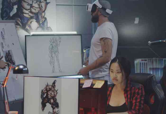 People working in a game design office.