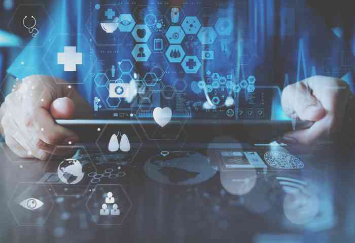 medical techonlogy concept,smart doctor hand working with modern laptop computer in modern office with virtual icon diagram