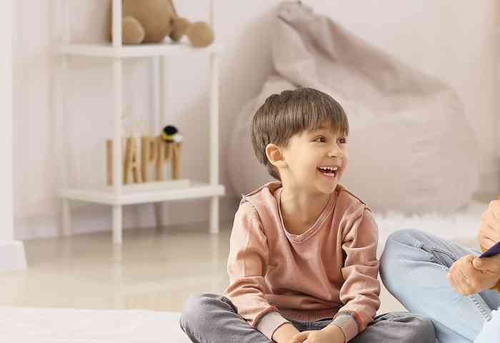 teacher sitting with a student
