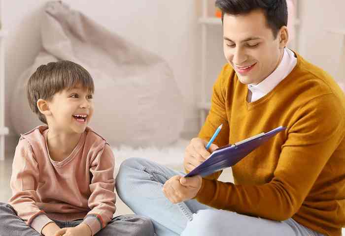 teacher sitting with a student