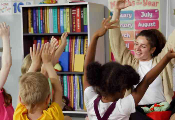 Teacher sitting in a circle with her students.