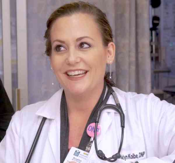 Brooklyn Kolbe, DNP, wearing scrubs and a stethoscope.